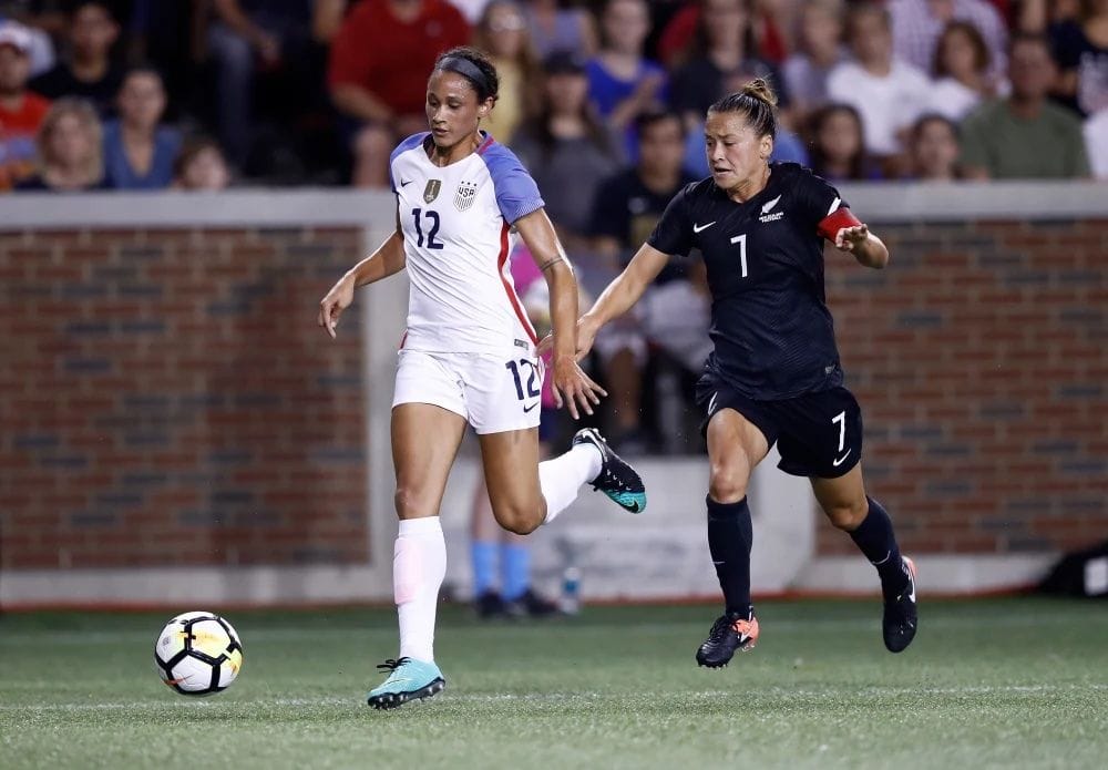 2 women playing professional soccer