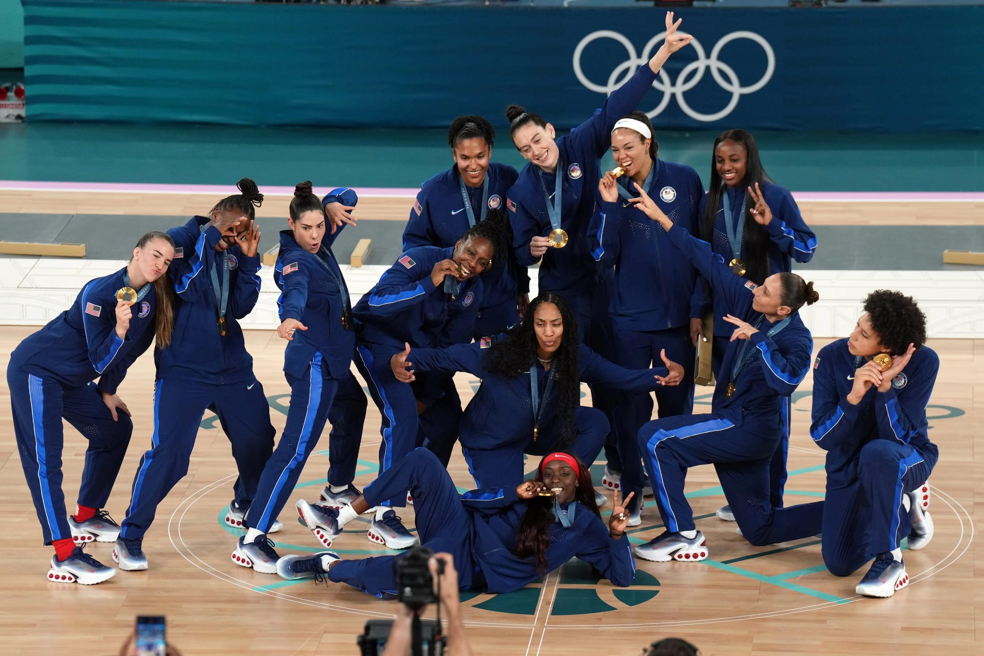Team USA celebrates with the gold medal after defeating France in the women’s basketball gold medal game during the Paris 2024 Olympic Summer Games at Accor Arena.
