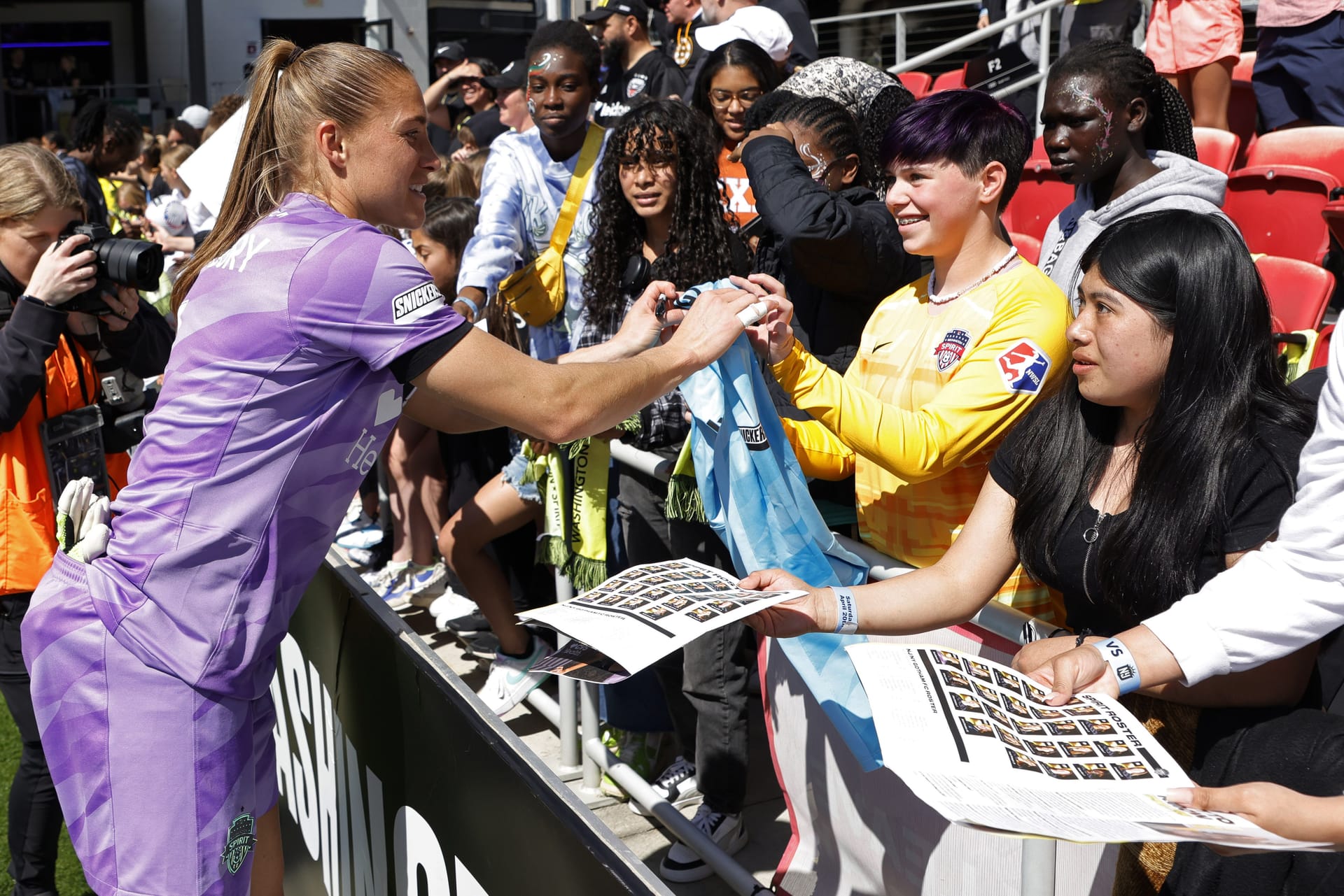 Washington Spirit goalkeeper Aubrey Kingsbury signs jersey for fans