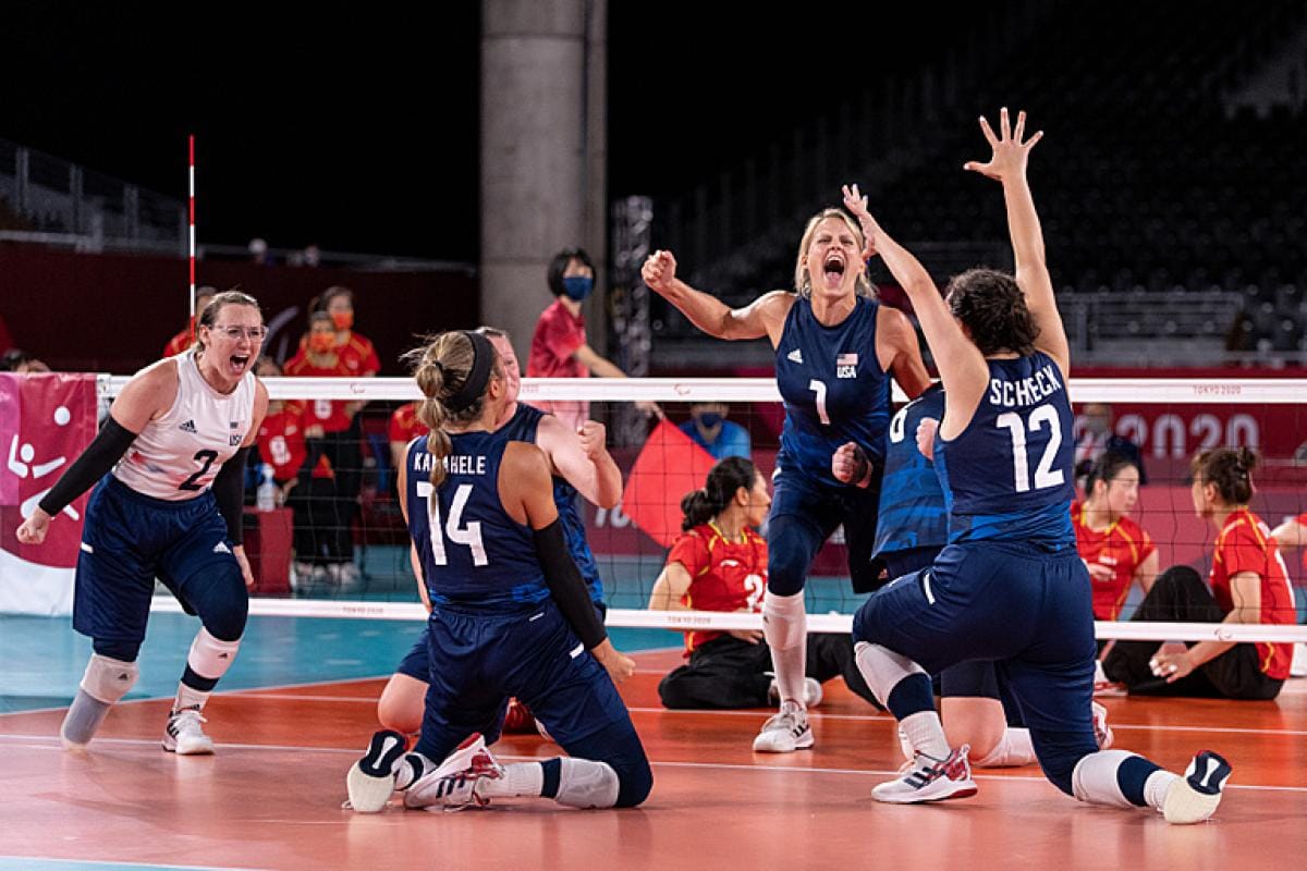 USA paralympic volleyball team celebrates on the court