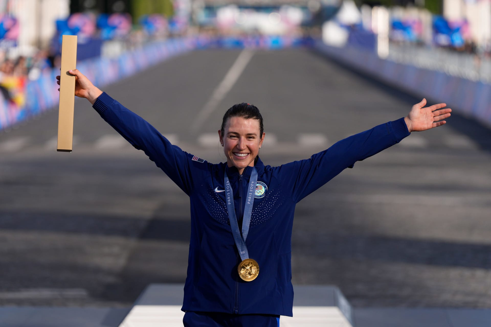 Gold medalist Kristen Faulkner (USA) celebrates after the women's cycling road race during the Paris 2024 Olympic Summer Games at Pont d'Iena.