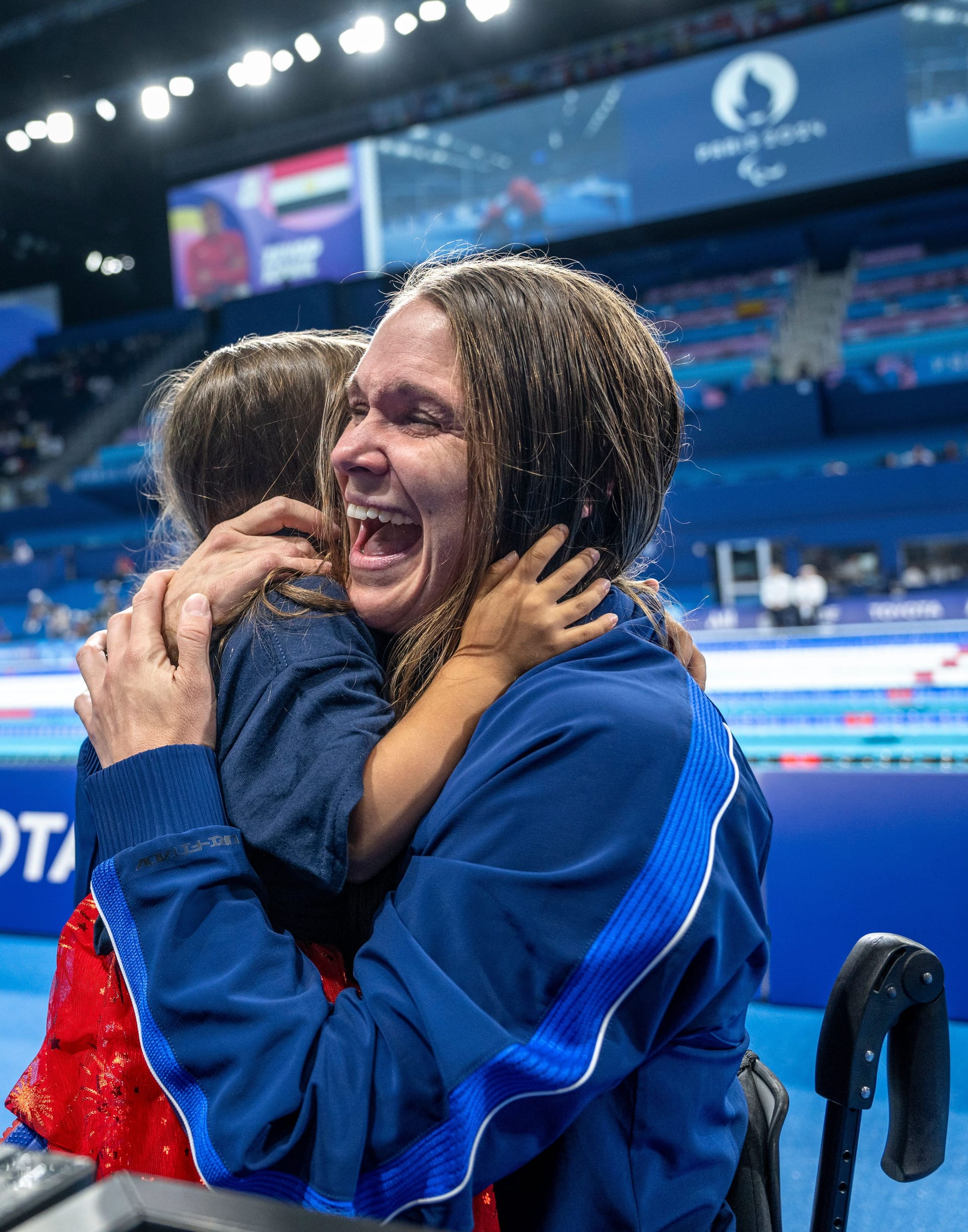 Christie Raleigh-Crossley celebrates with family after winning the silver medal for the para swimming