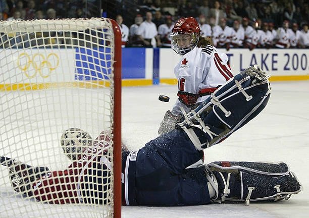 Jayna Hefford scoring a goal at an Olympic hockey game