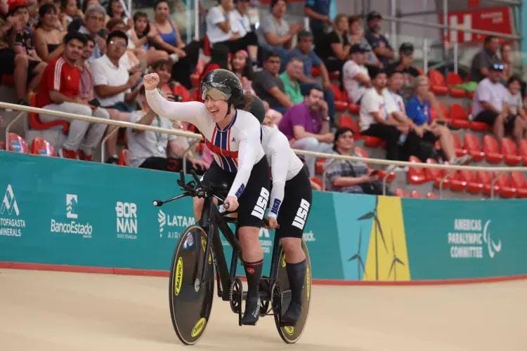 Skyler Samuelson Espinoza exults after she and tandem cyclist teammate Hannah Chadwick complete a race at the 2023 Parapan American Games. Photo by Pablo Bigorra/Parapanamericanos via Photosport