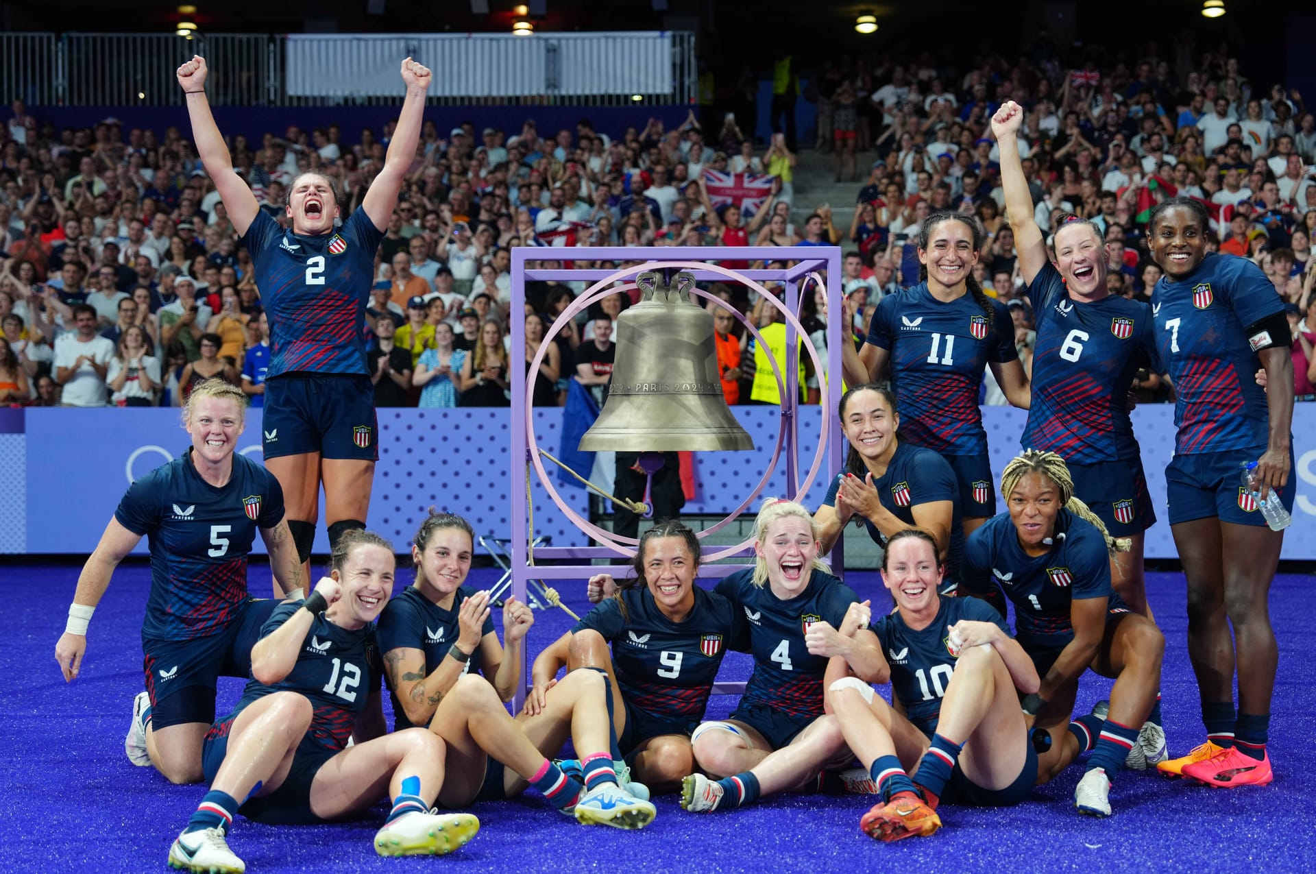 Jul 29, 2024; Paris Saint-Denis, France; United States players celebrate after defeating Great Britain in a women's quarterfinal rugby match during the Paris 2024 Olympic Summer Games at Stade de France. Credit: Kirby Lee-Imagn Images