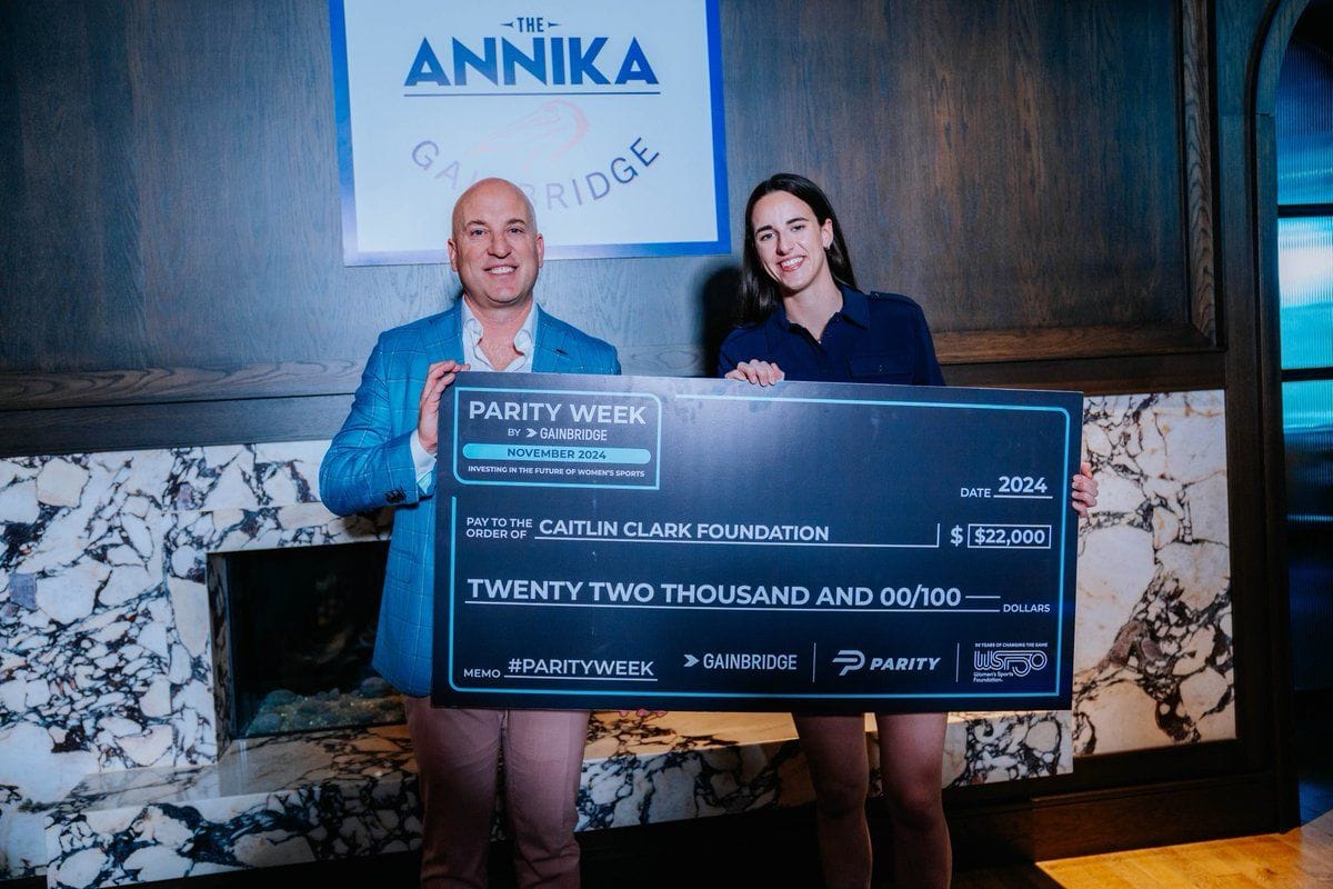 Group 1001 CEO Dan Towriss and Caitlin Clark