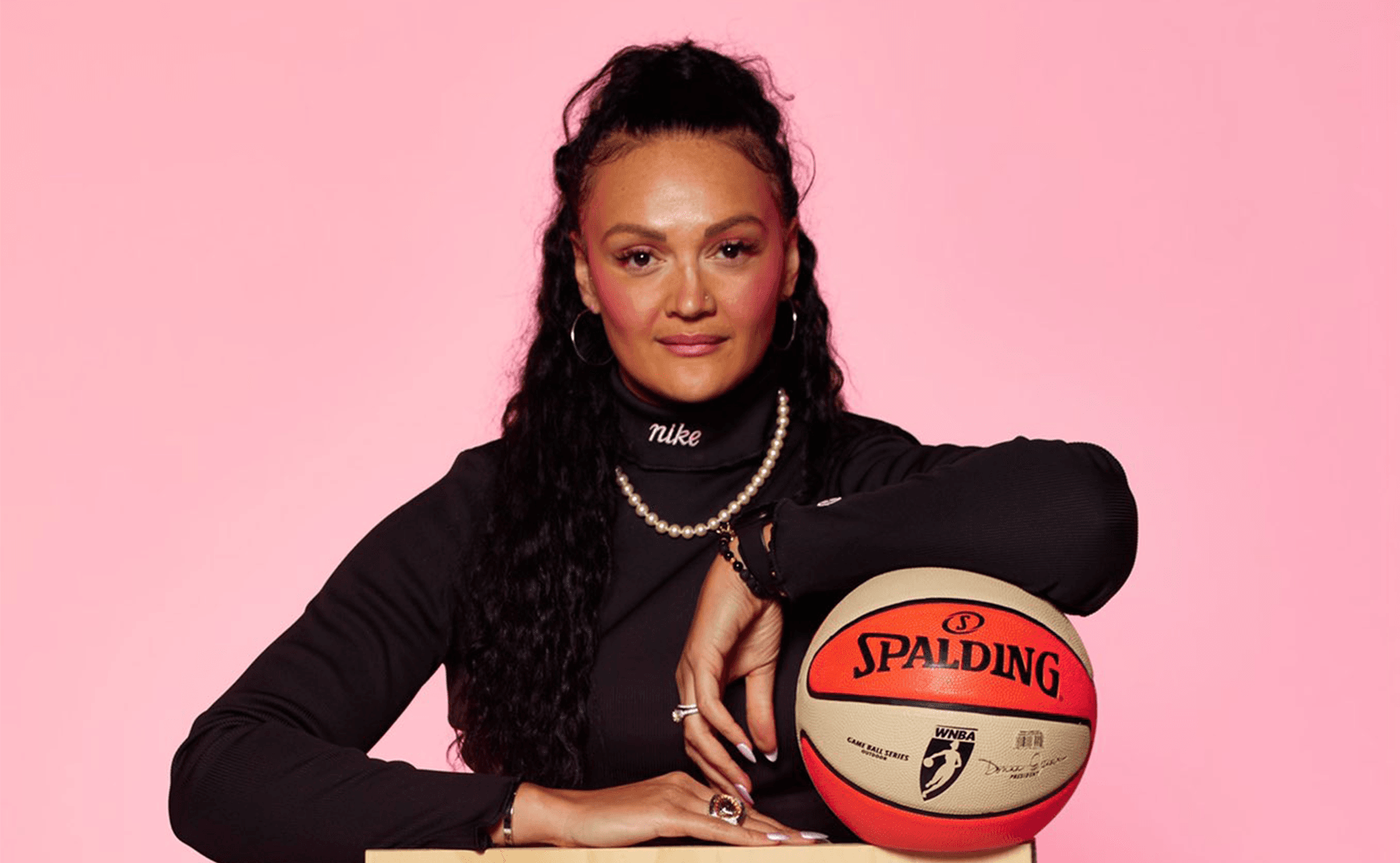 Mistie posing for photoshoot with basketball