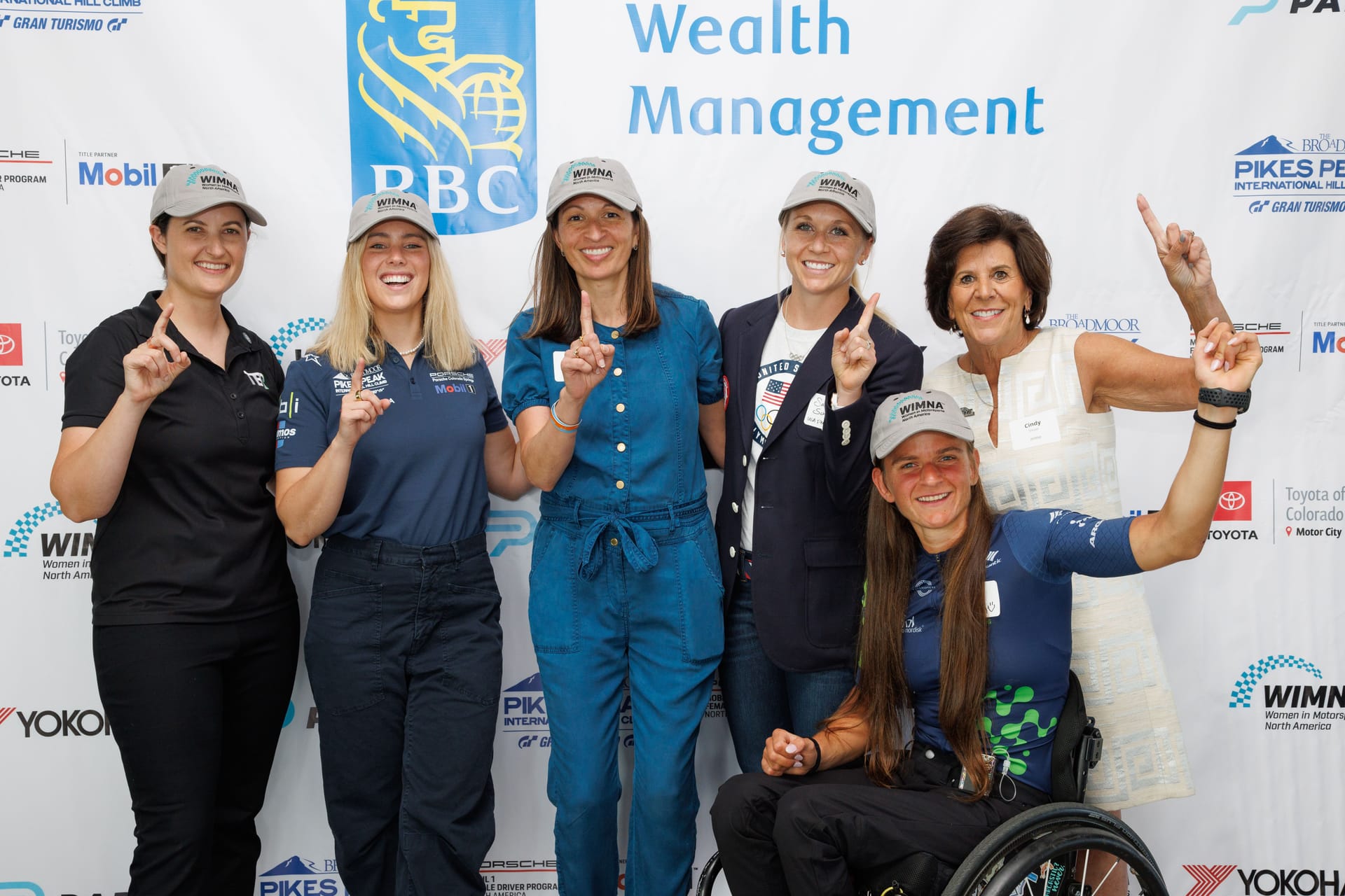 Group photo of Sammy Schultz, other athletes, and Parity CEO at Pike's Peak event