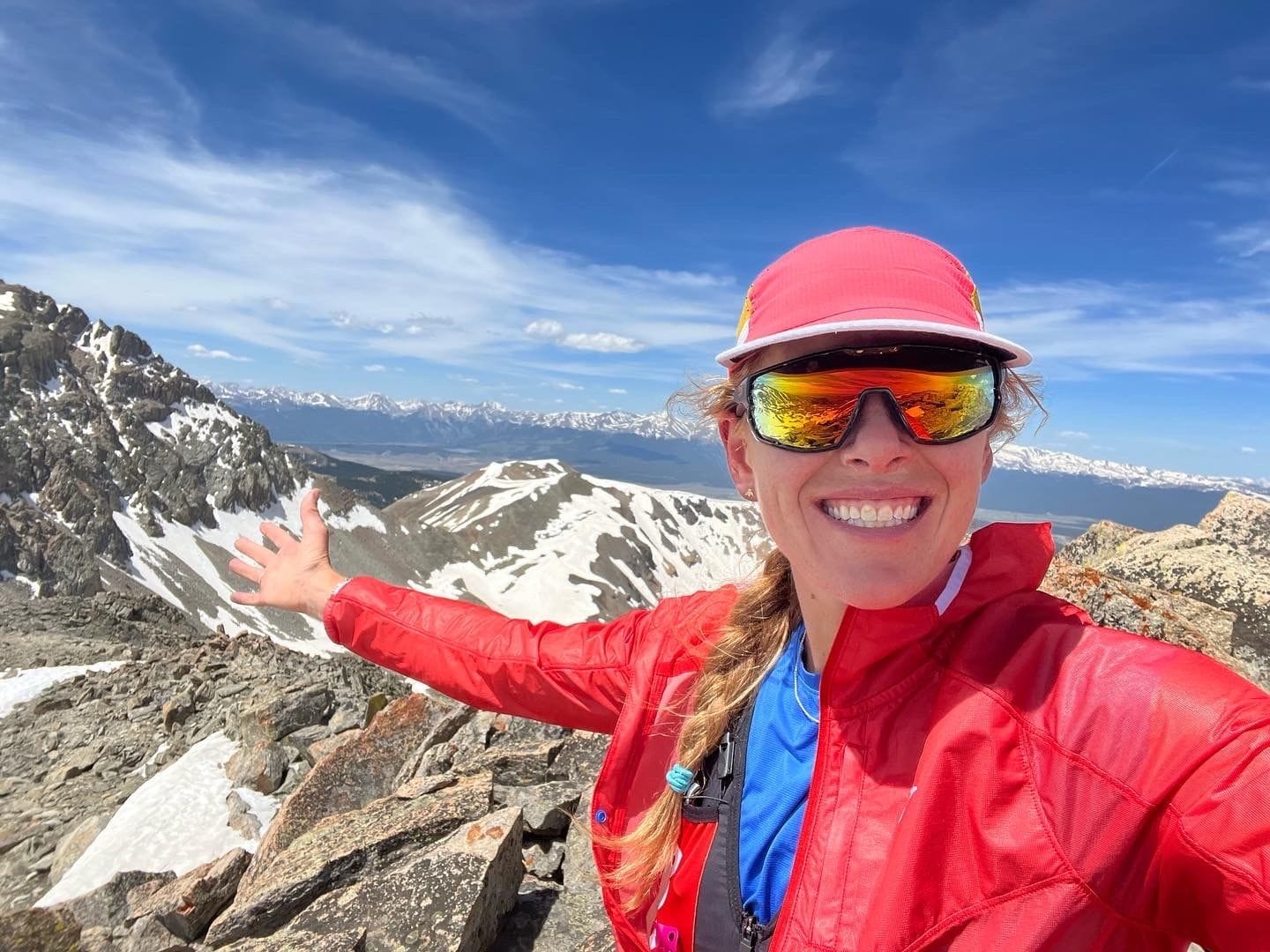 Hillary Allen selfie smiling on top of a mountain