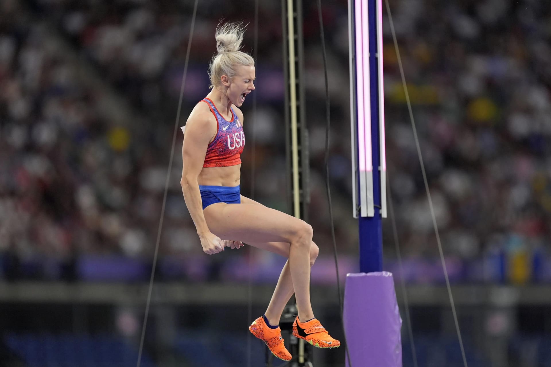 Katie Moon (USA) reacts after clearing 4.85m in the women's pole vault final during the Paris 2024 Olympic Summer Games at Stade de France.