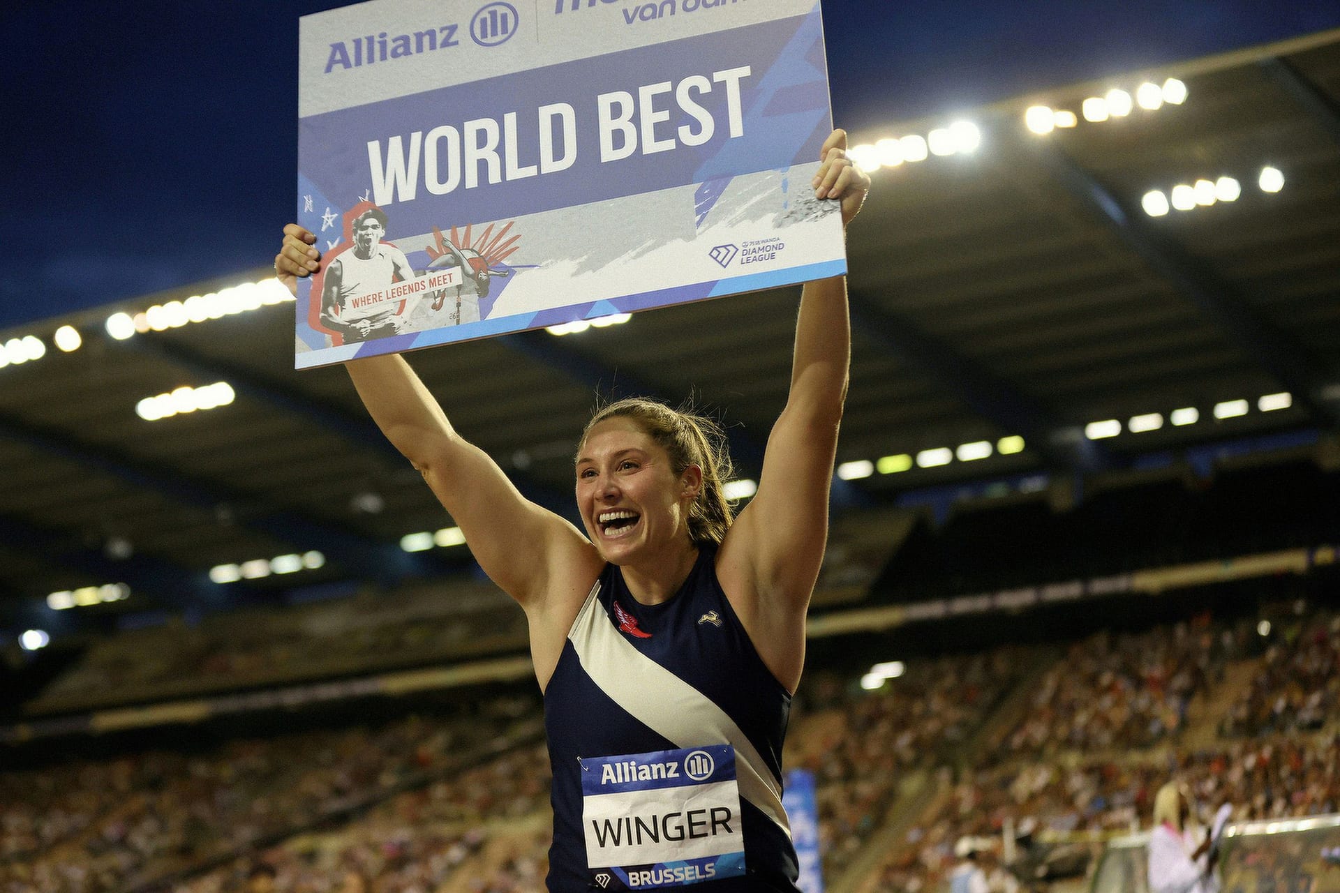 Kara Winger holding "World Best" sign