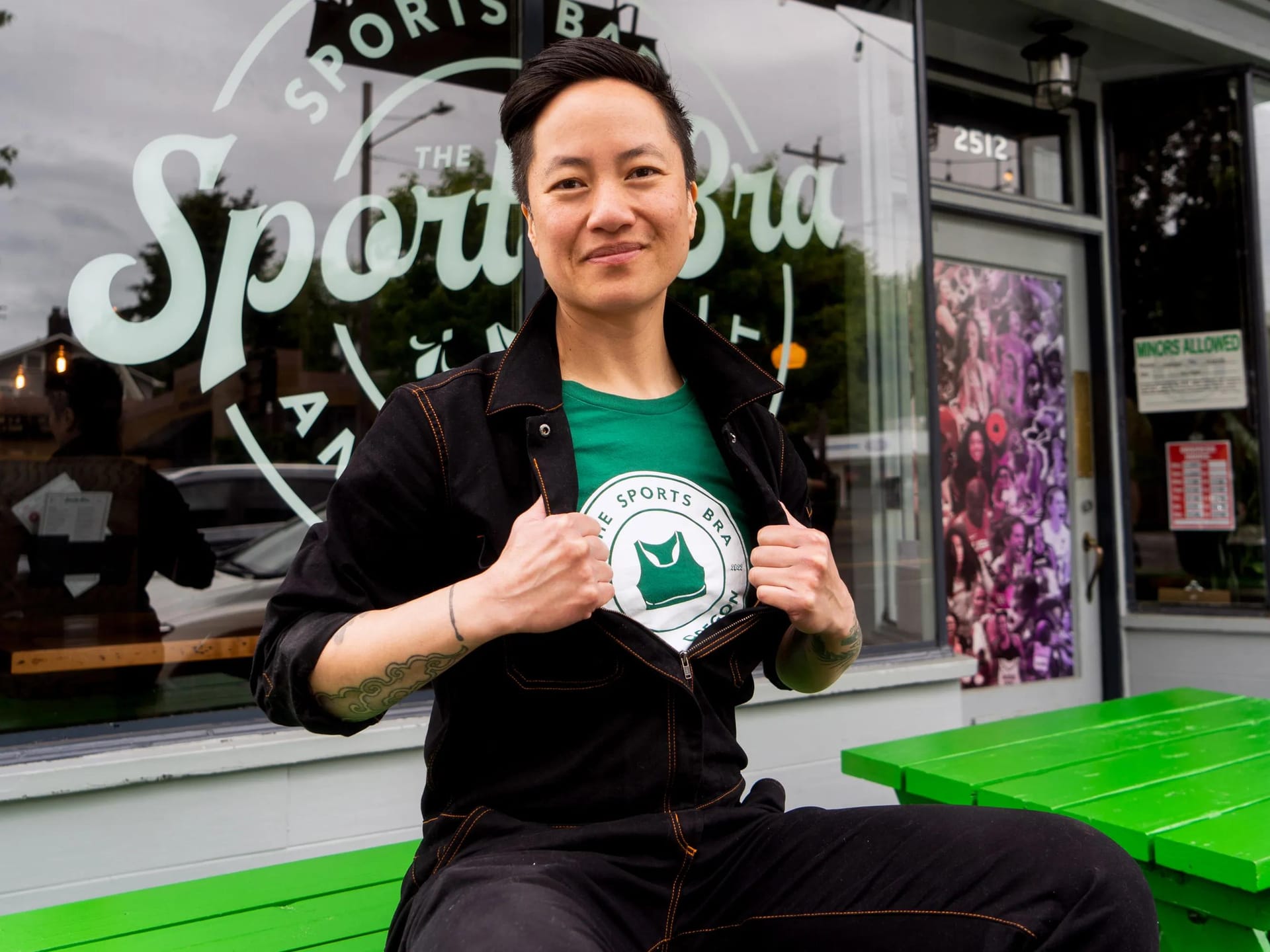 Jenny Nguyen poses in front of The Sports Bra bar