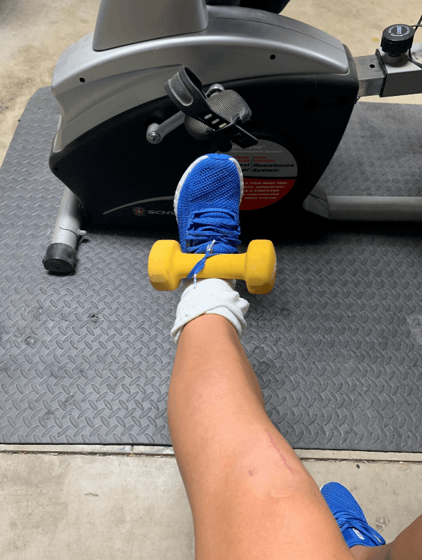 Marley lifting a dumbell with her leg