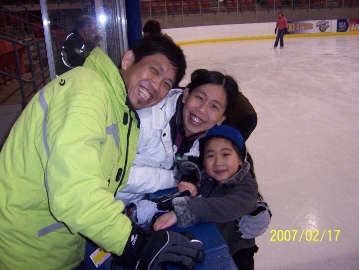 Early love on the ice: Me at age six on an ice skating rink, posing with my parents.